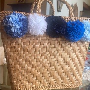 Woven Basket with Blue Pompoms